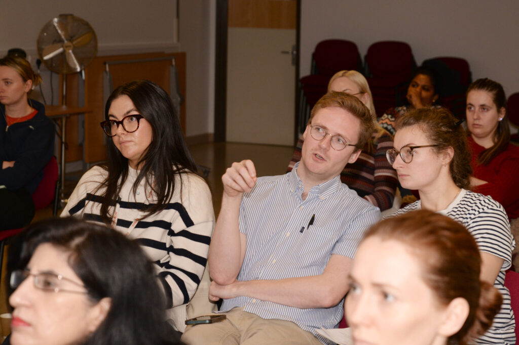 Delegates listening to a lecture