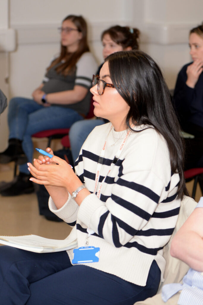 A delegate listening during a lecture