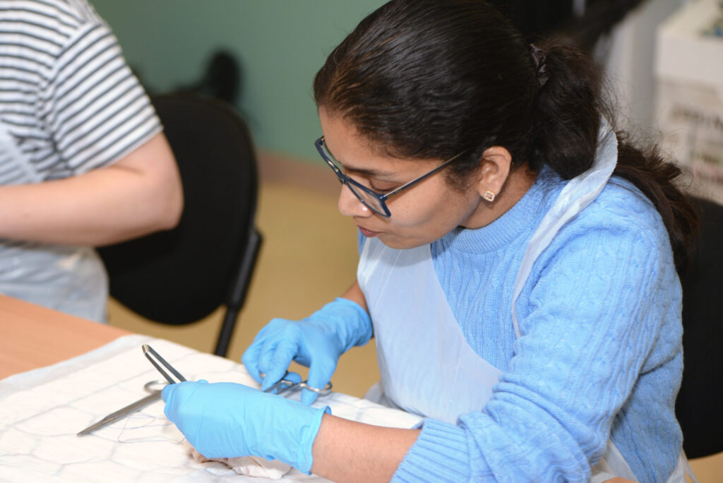 A delegate repairing an animal-tissue model during the workshop
